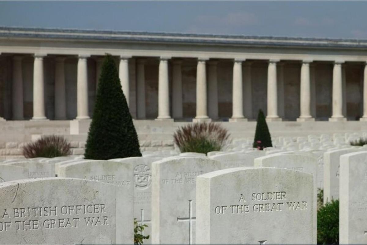 a bunch of tombstones in front of a building