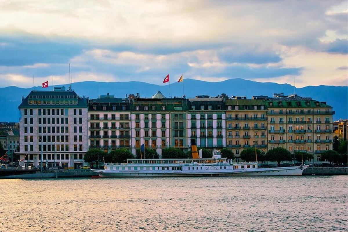 a large building with a boat in the water