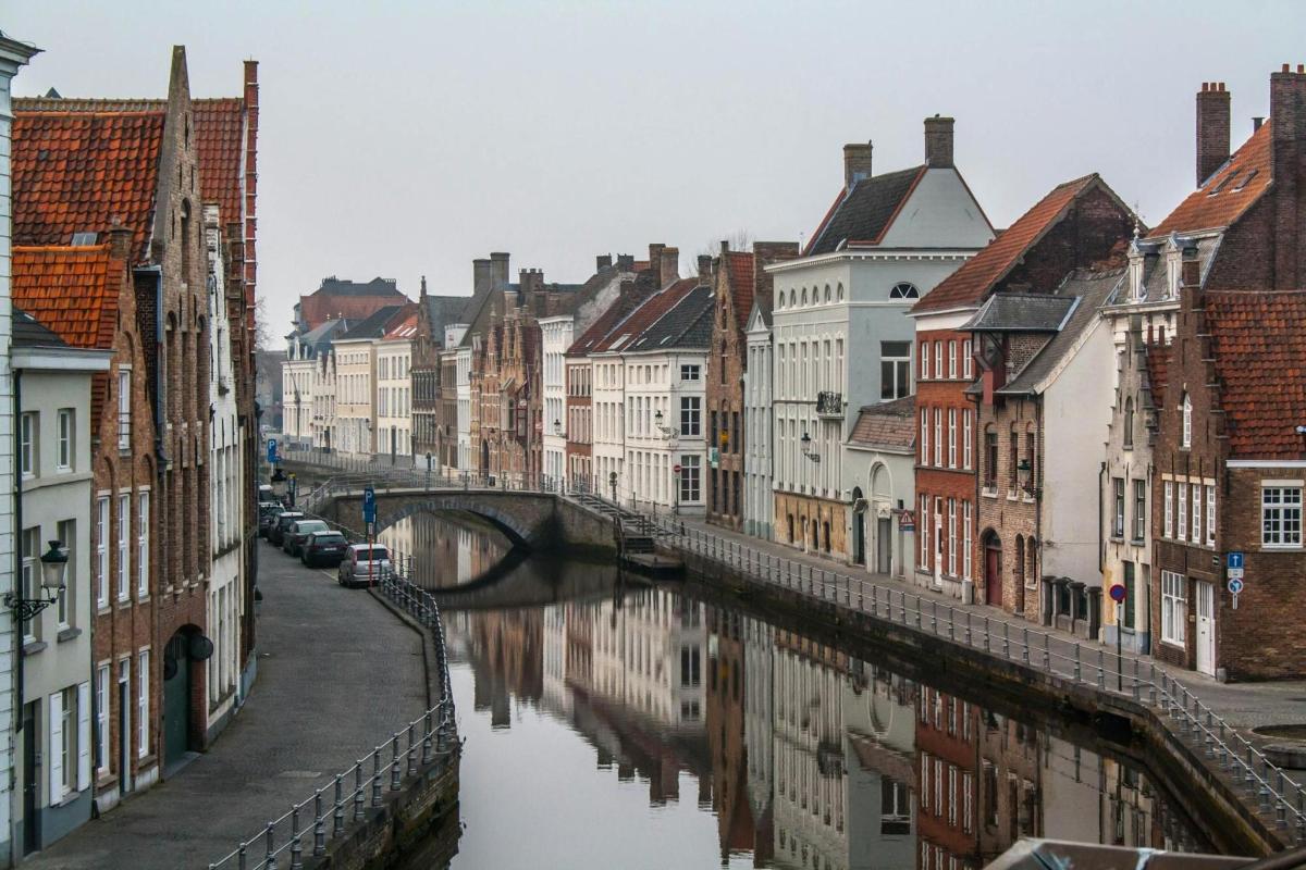 a city with a bridge over a river with buildings