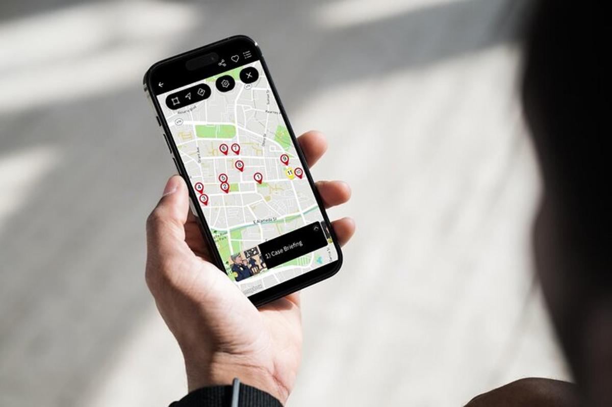 a person holding a cell phone with a map on it