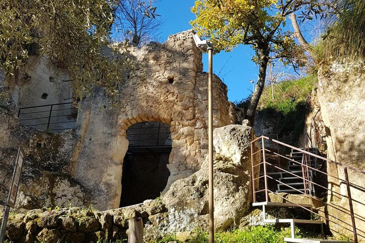 an entrance to a cave in a rock formation