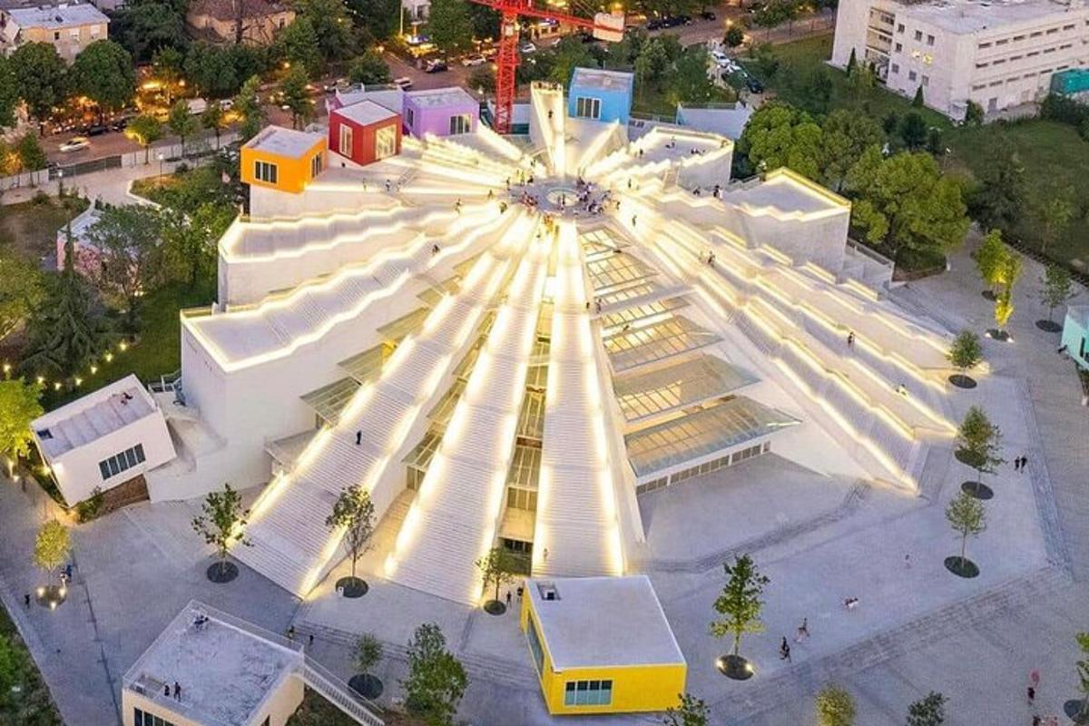 an overhead view of a building with a ferris wheel