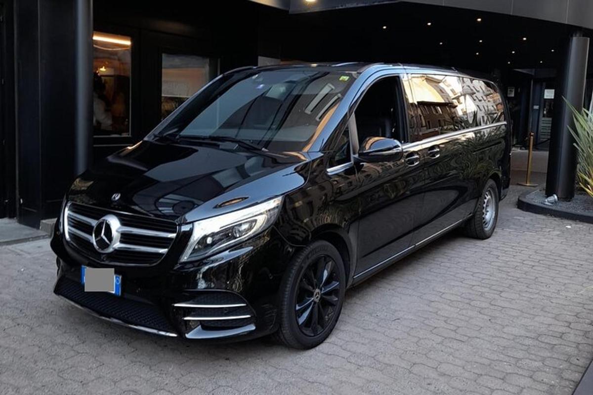 a mercedes benz van parked in front of a building