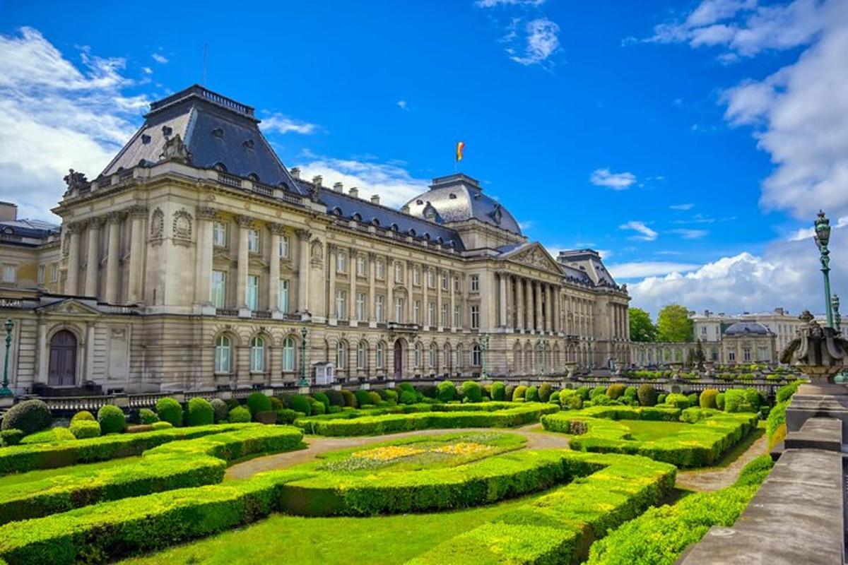 a large building with a garden in front of it