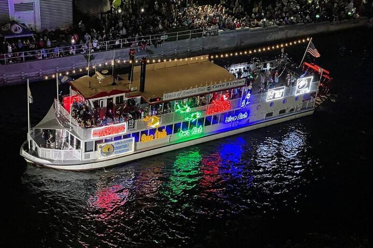 a boat filled with people on the water at night