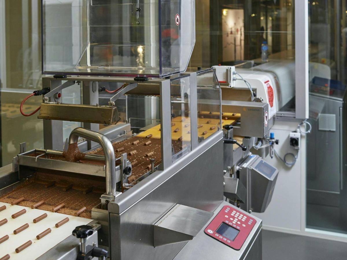 a machine that is making wood on a table