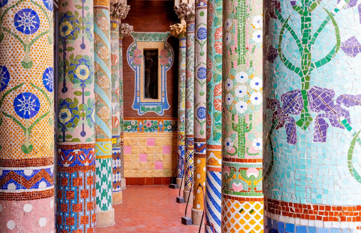 a row of colorful tiled columns in a room