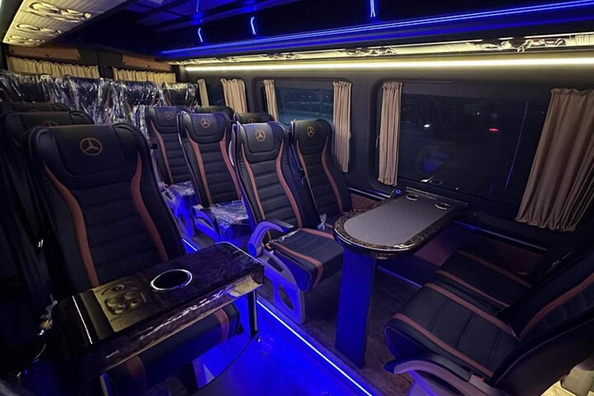 an empty train car with chairs and a tv