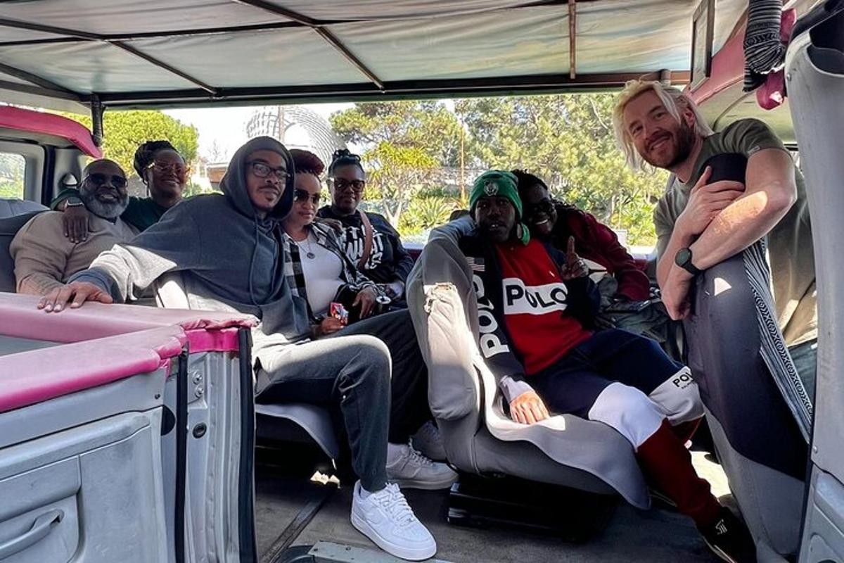 a group of people sitting in the back of a truck