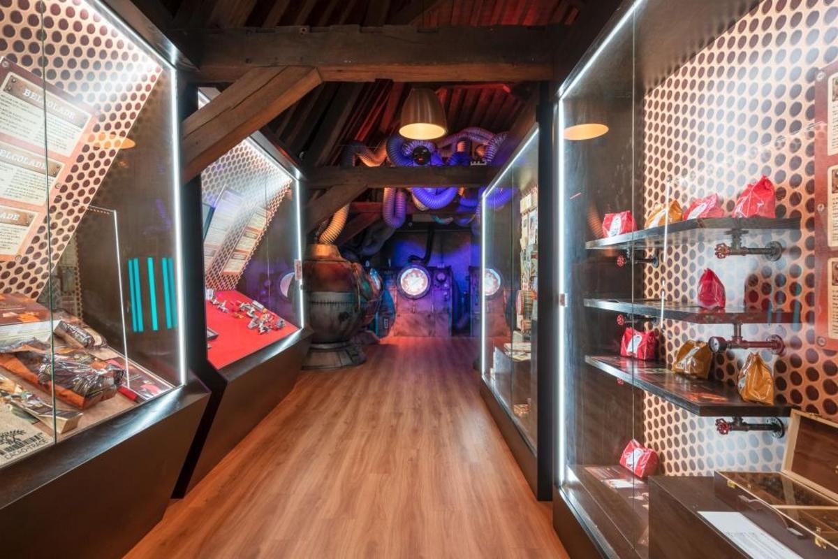 a hallway in a room with a room with shelves