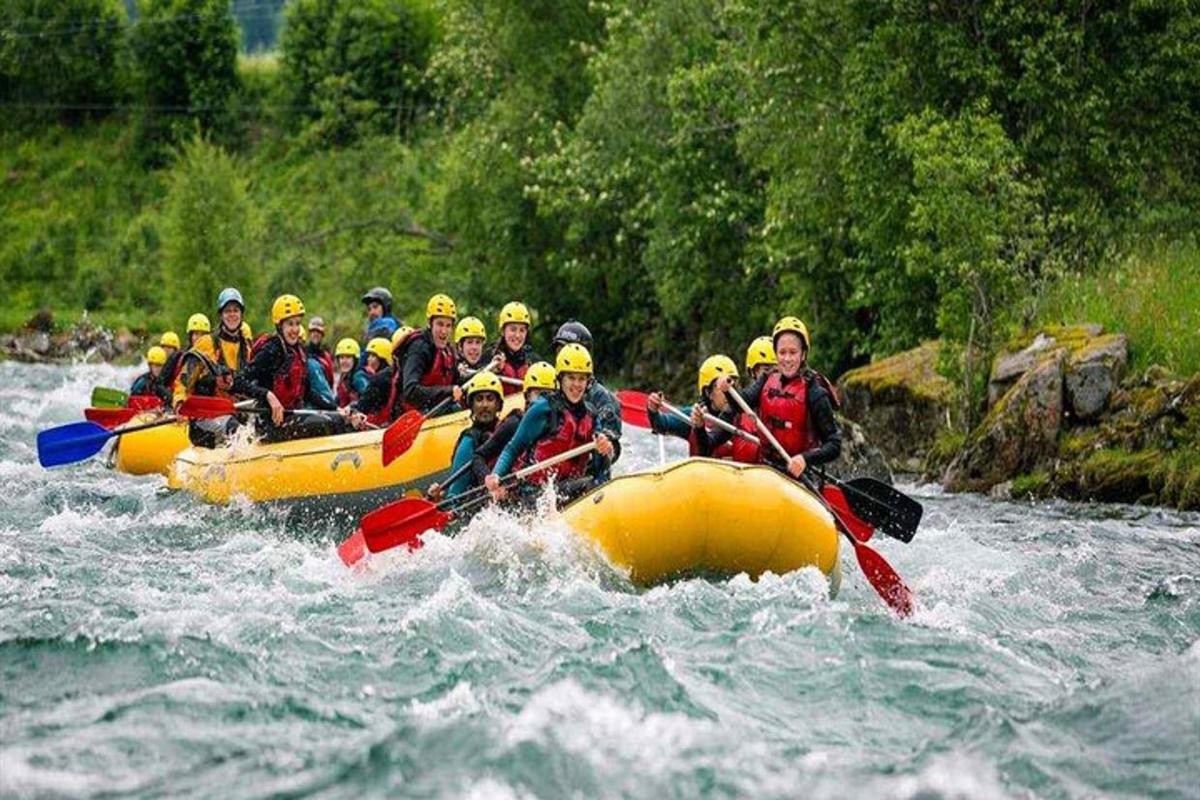 a group of people in a raft in the water