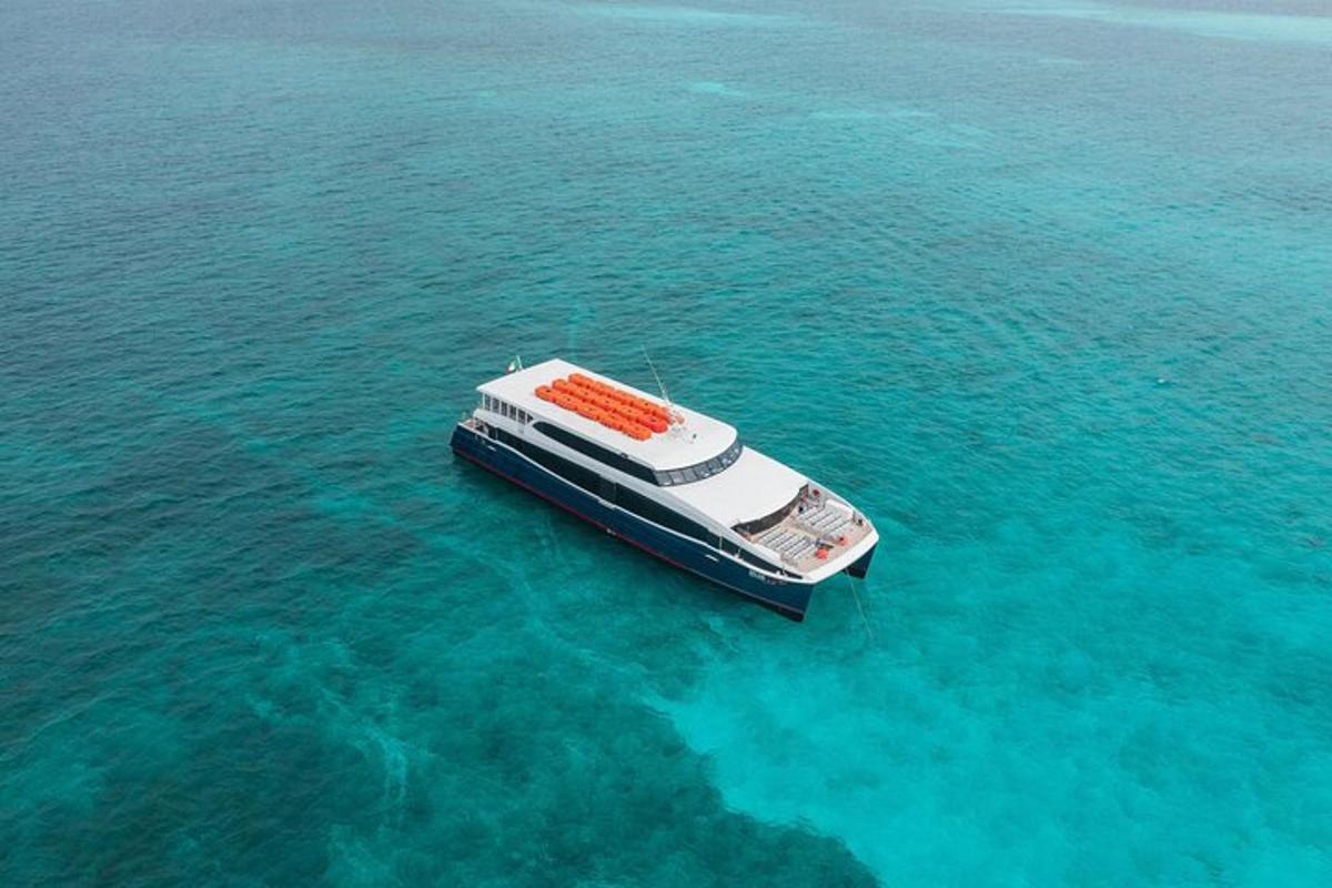 a boat floating in the water in the ocean
