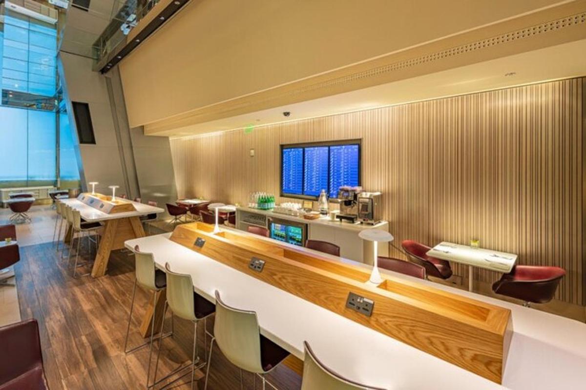 a large room with a bar and some tables and chairs