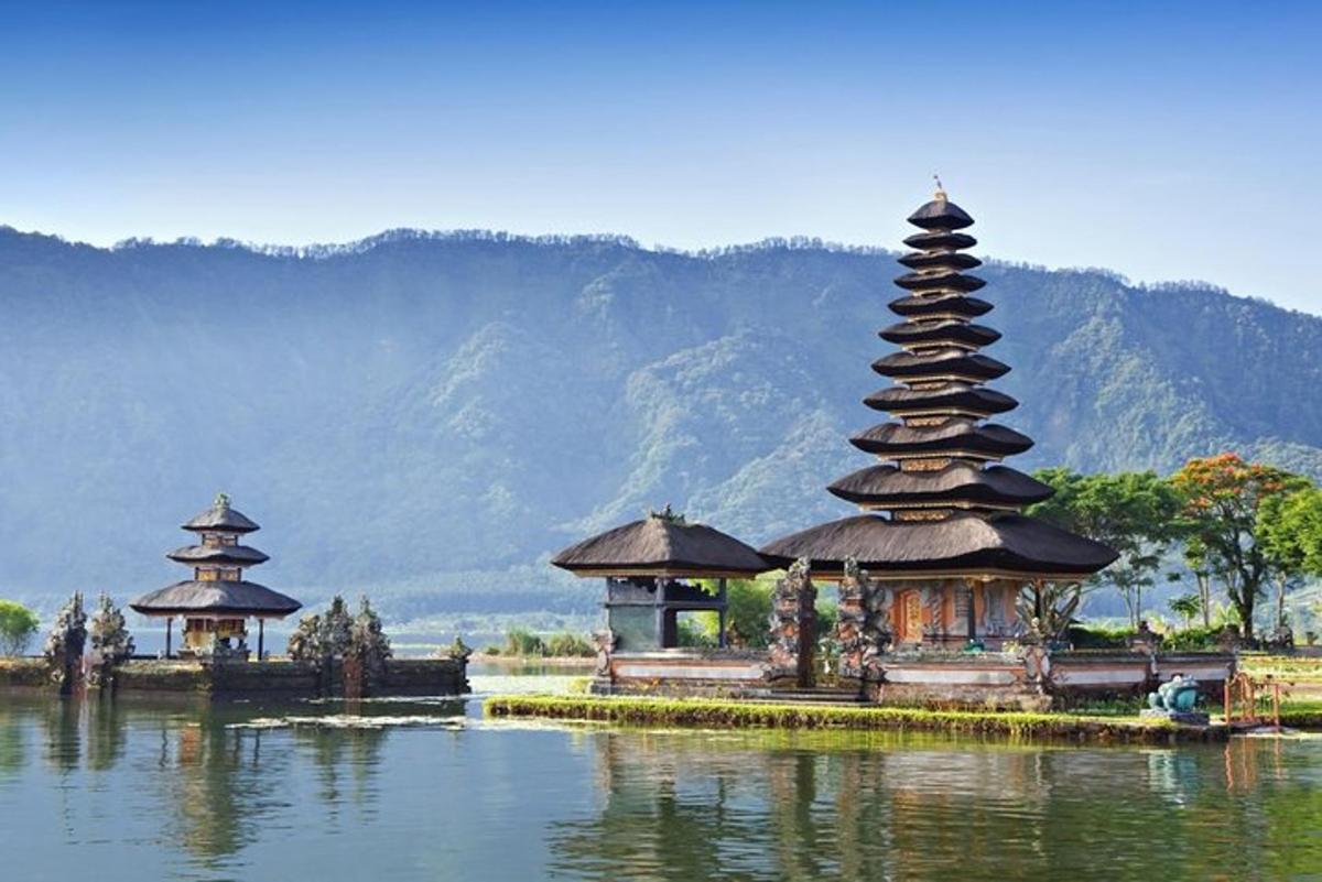 a group of temples in the middle of a body of water