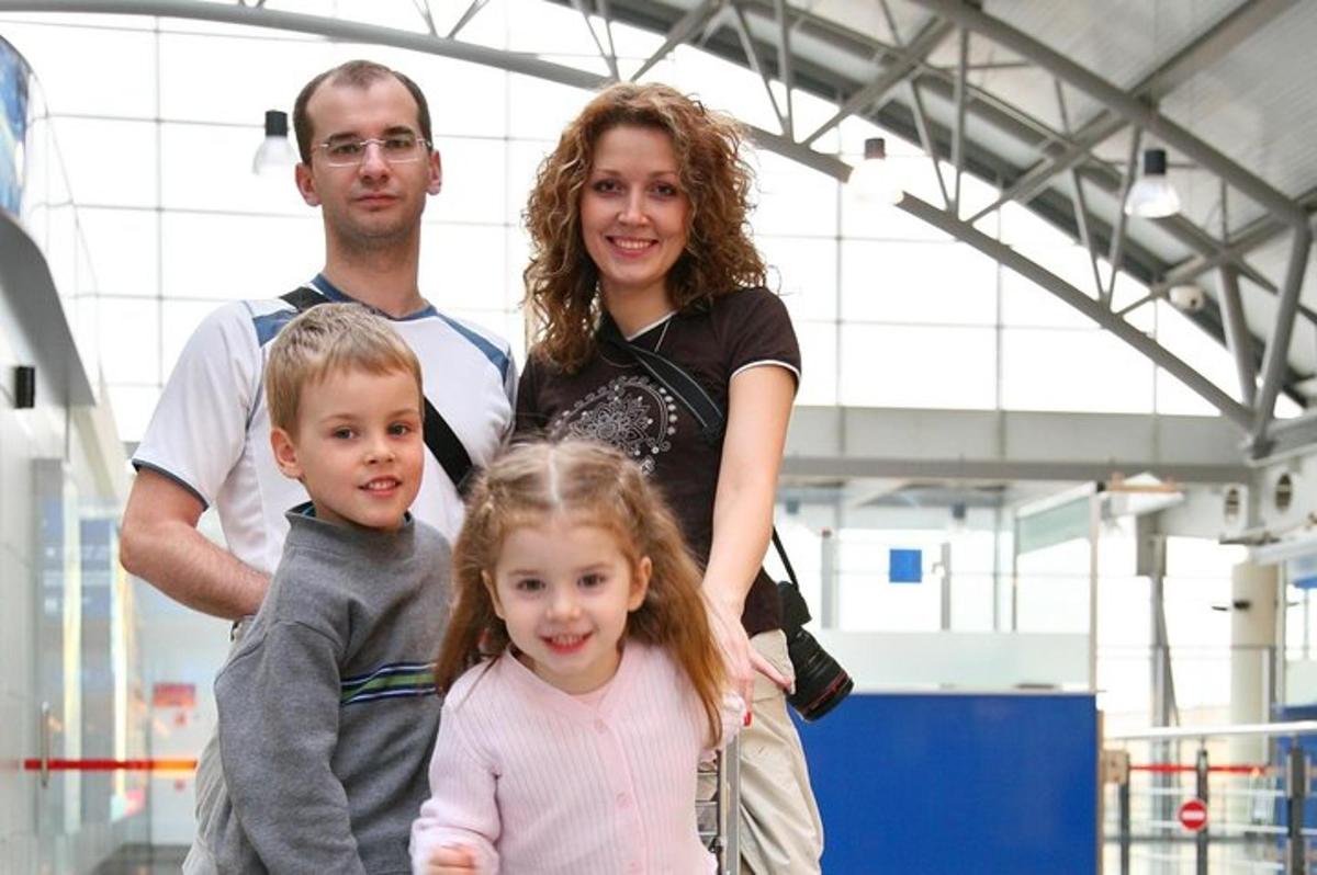 a man and a woman and a child posing for a picture