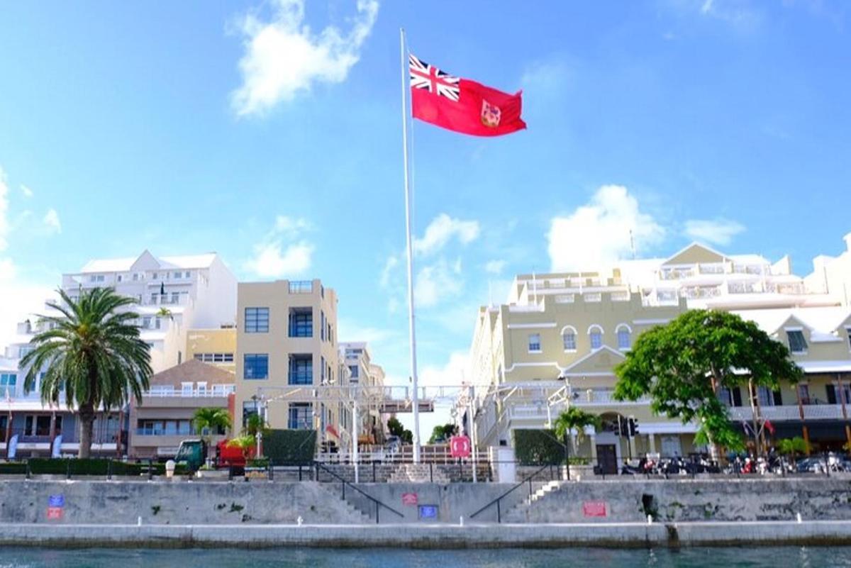 a canadian flag flying in front of buildings