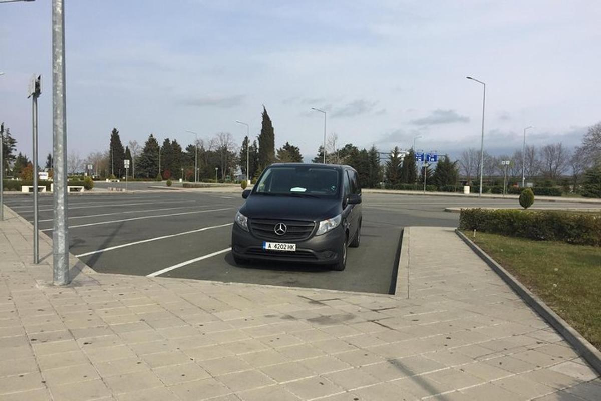 a black car parked in a parking lot