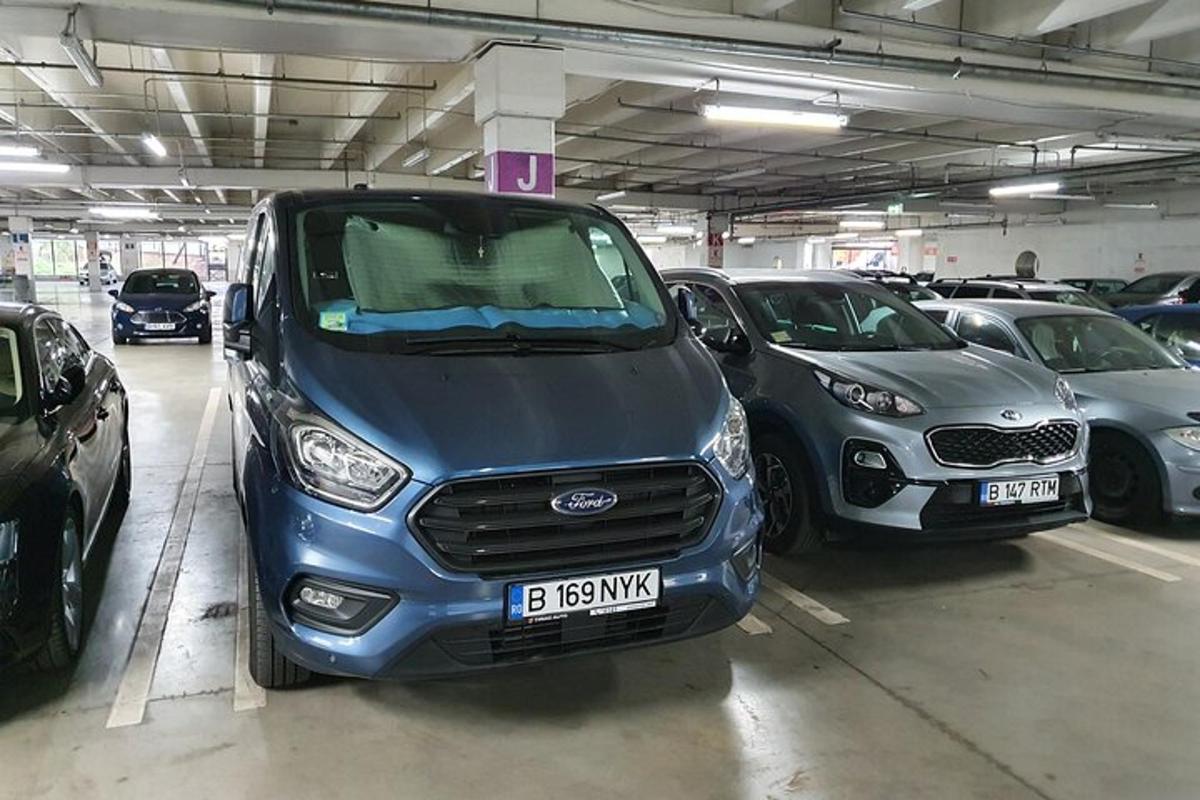 a group of cars parked in a parking garage