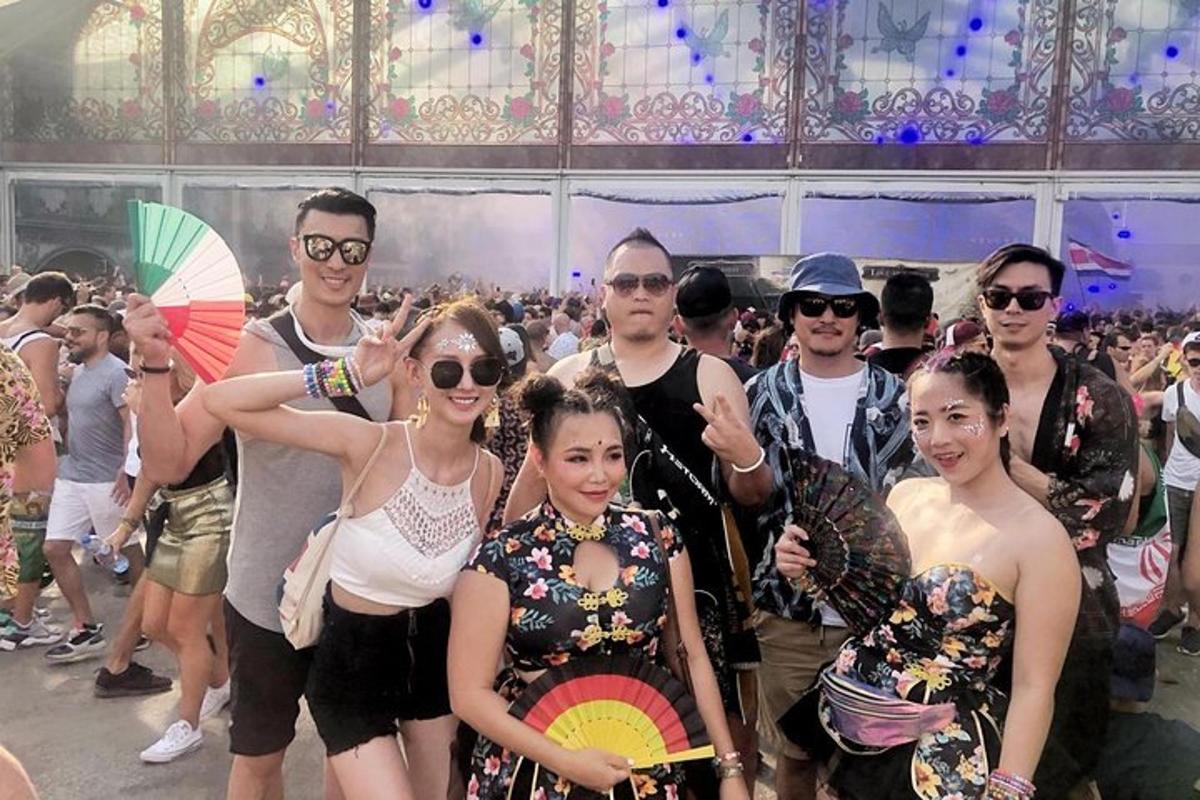 a group of people posing for a picture in a crowd