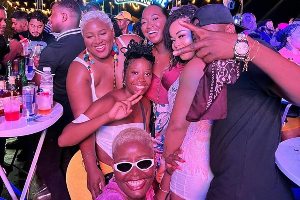 a group of people posing for a picture at a party