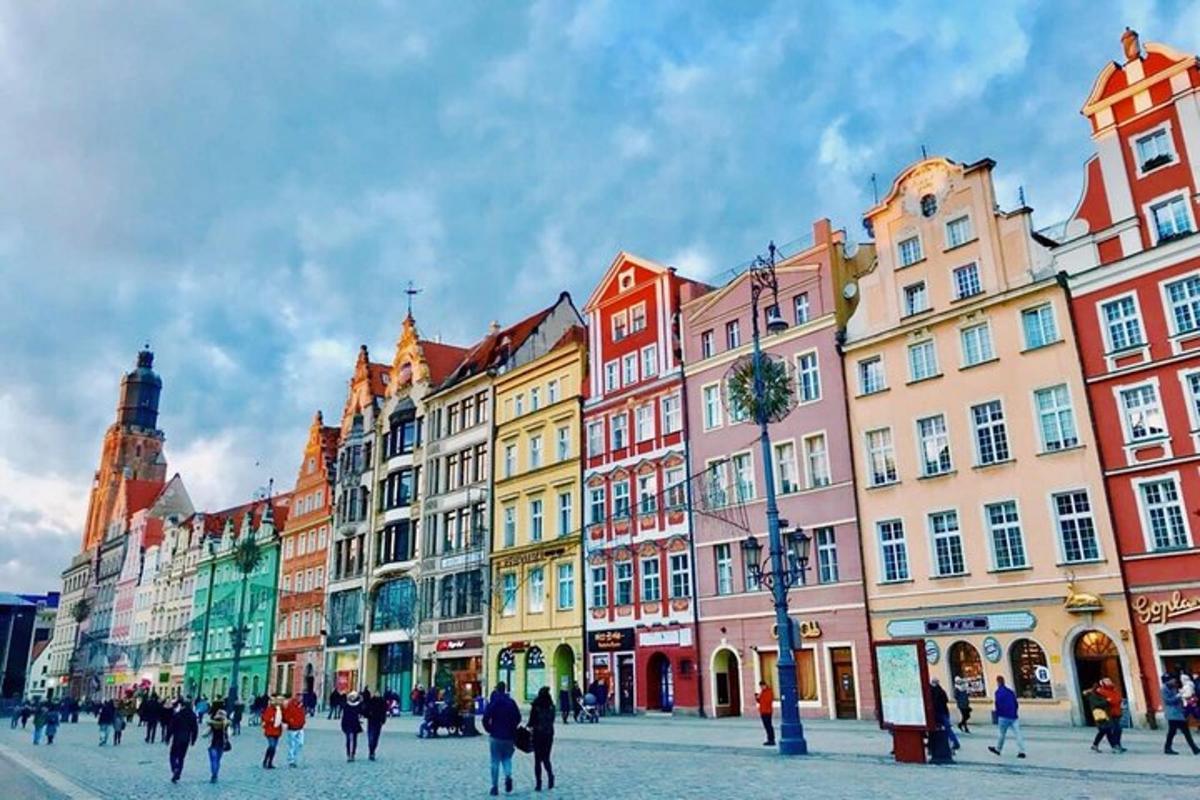 a group of people walking on a street with buildings