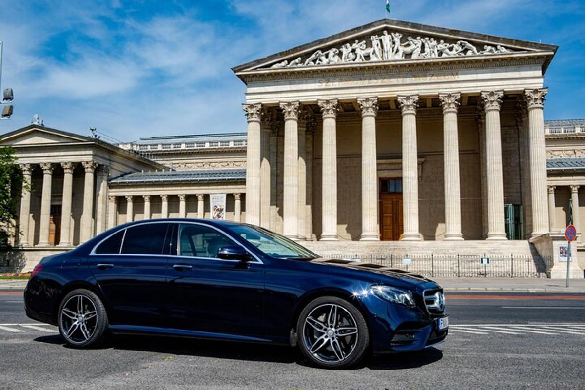 a blue car parked in front of a building