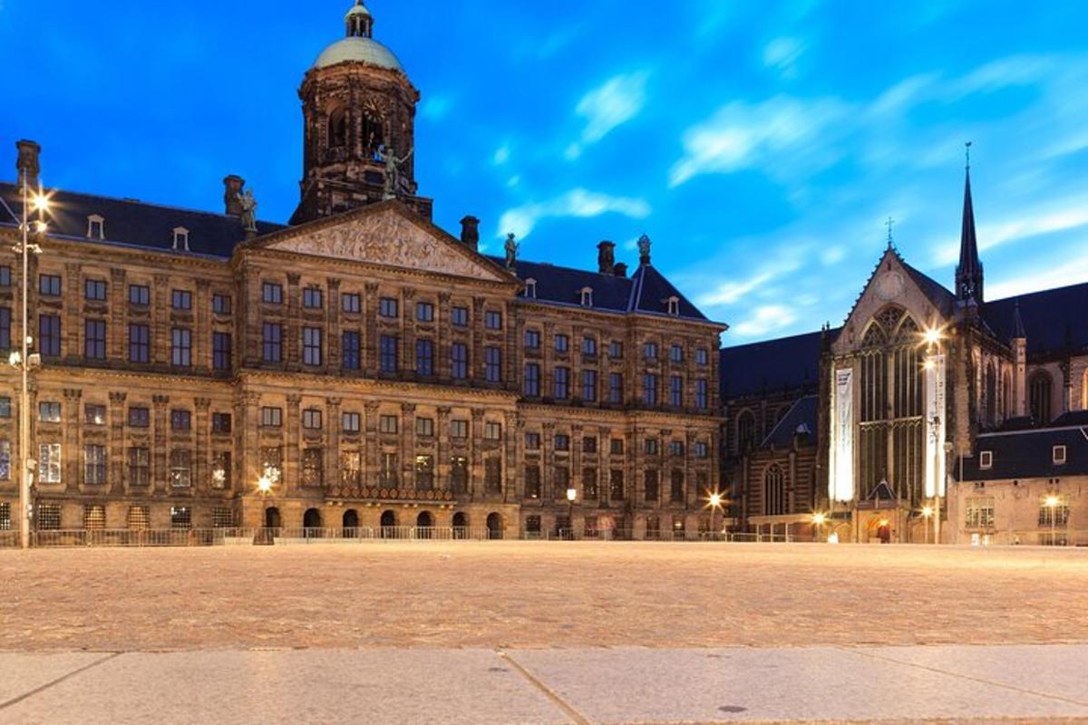 a large building with a clock tower at night