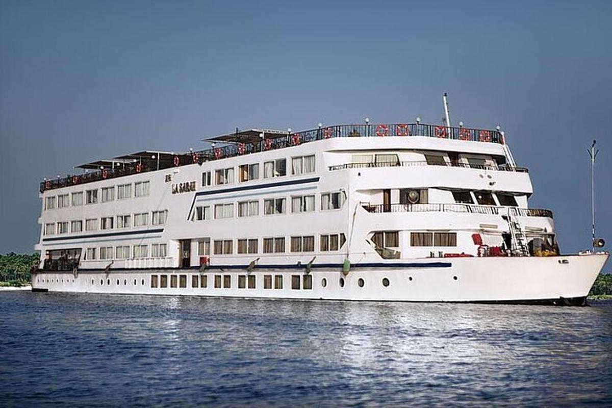 a large white cruise ship in the water