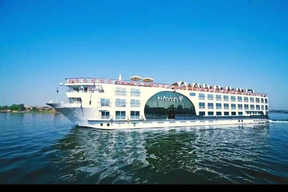 a cruise ship with people on it on the water