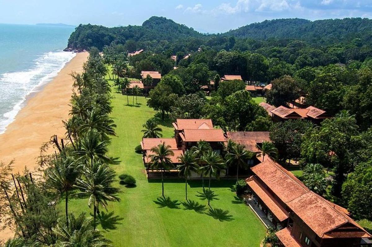 an aerial view of a resort near the beach