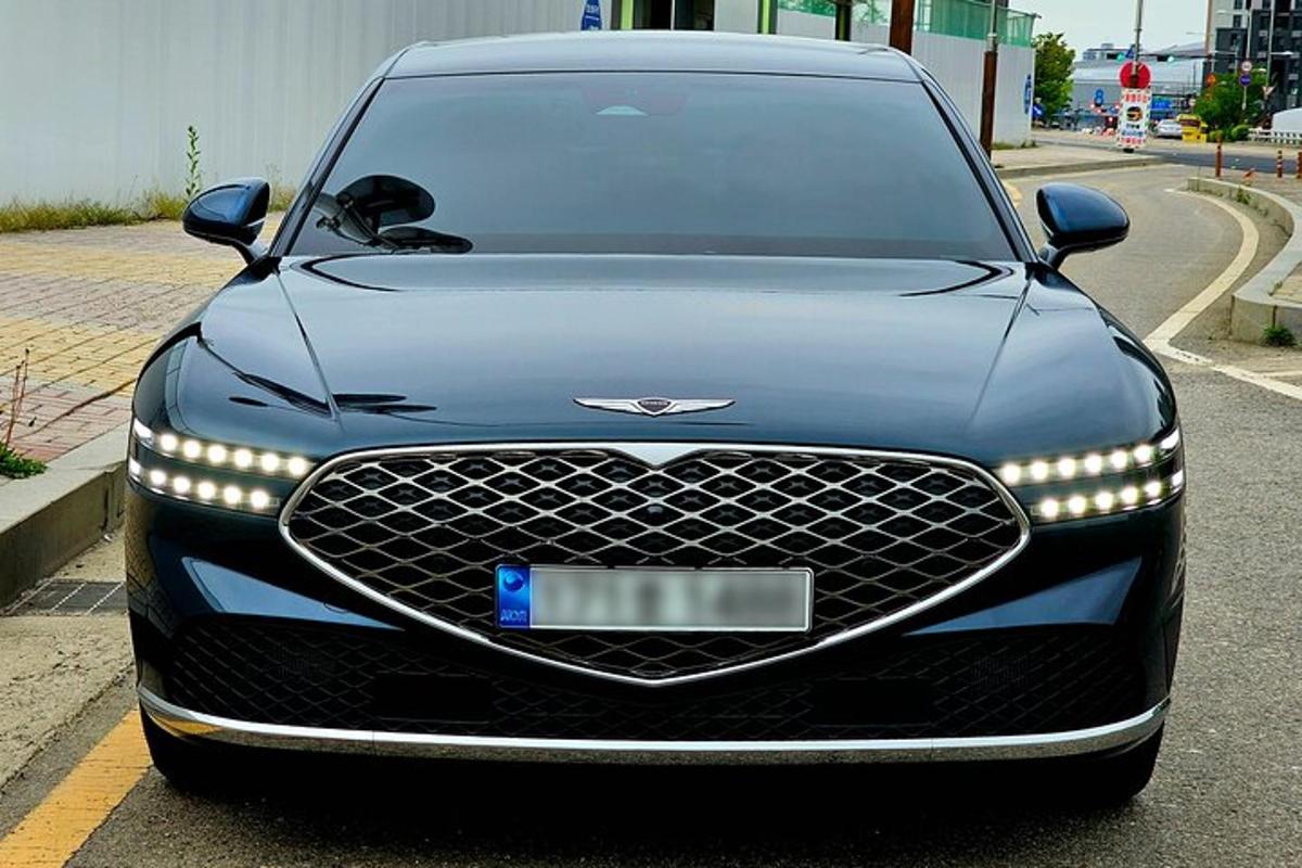 a black car is parked on a street