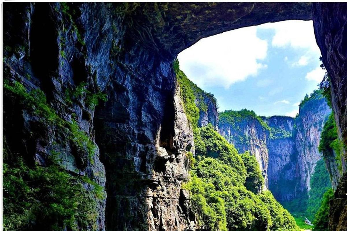 a view of a mountain with a tunnel in it