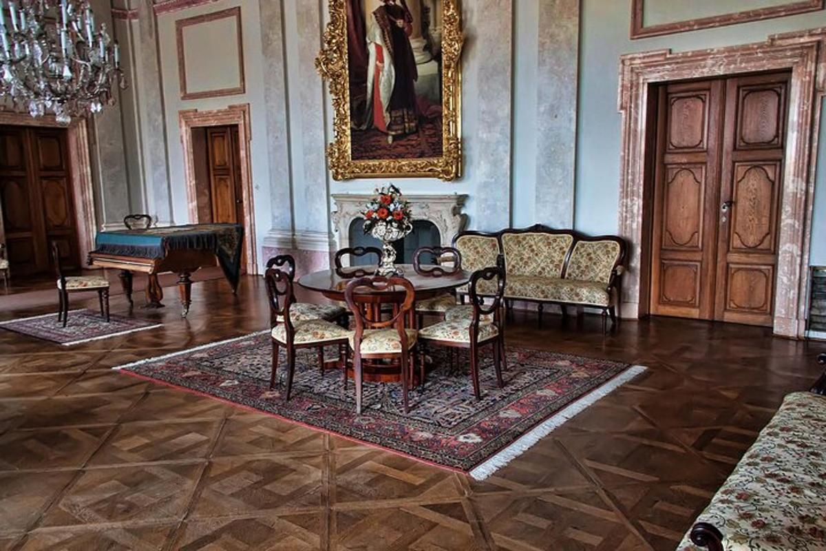 a living room with a table and chairs in a room