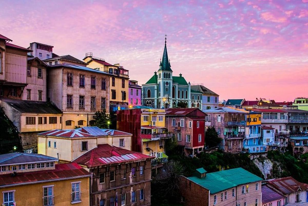 a group of buildings with a church in the background