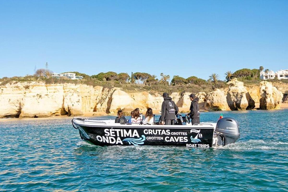 a group of people on a speed boat in the water