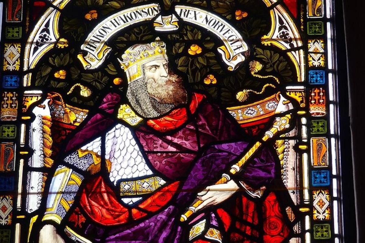 a stained glass window of a man holding a sword