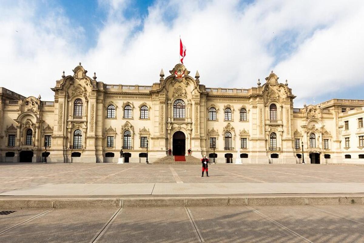 a man standing in front of a large building