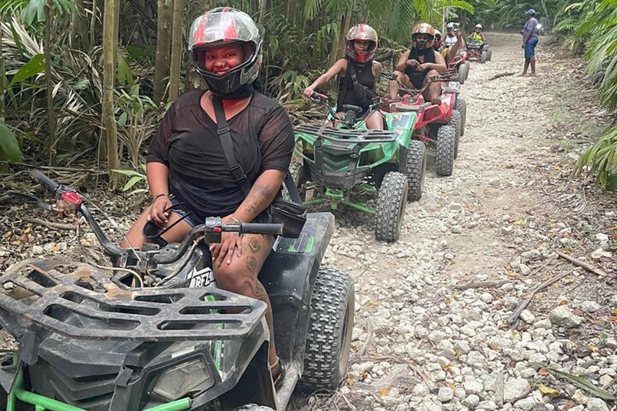 isang grupo ng mga tao na nakasakay sa mga atv sa isang maruming kalsada