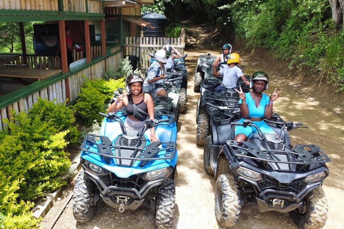 isang grupo ng mga tao na nakasakay sa mga atv sa isang dirt trail
