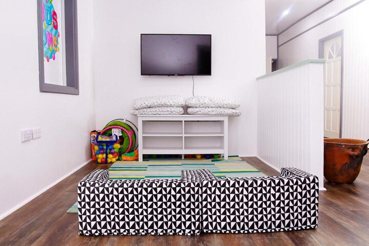 a living room with a tv on a wall