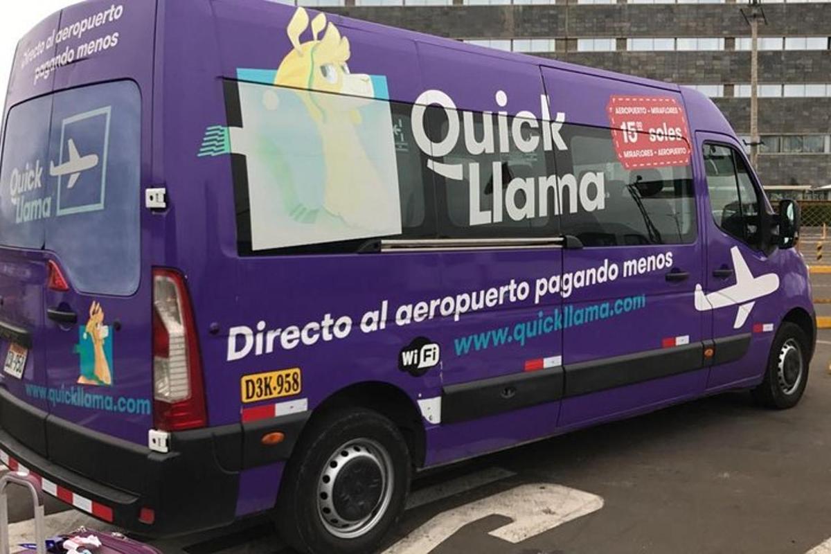 a purple truck is parked in a parking lot