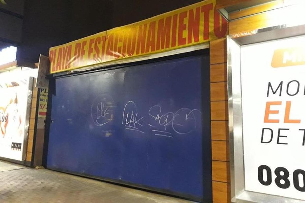 a store with graffiti on the side of it