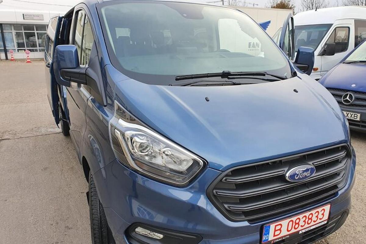 a blue van parked in a parking lot