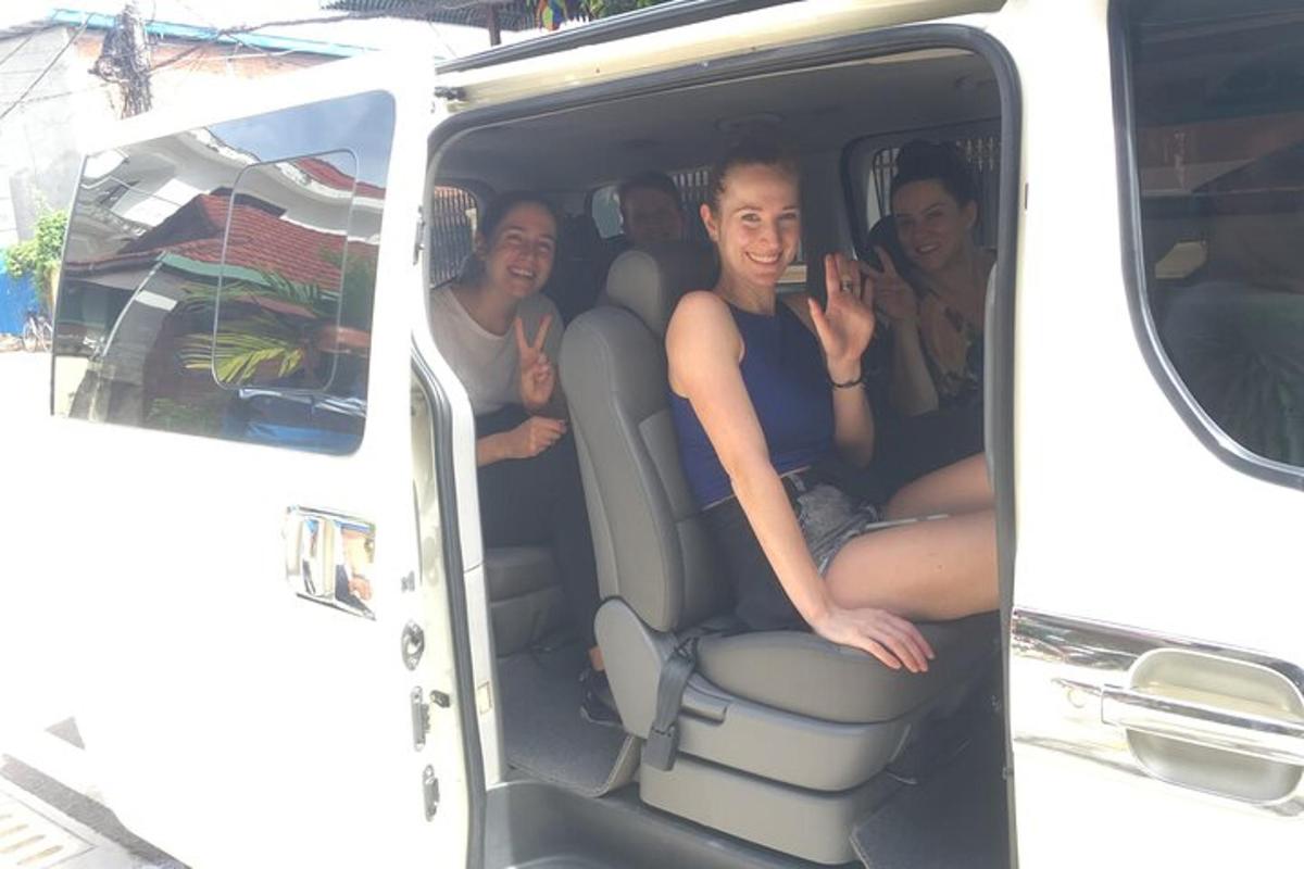 a group of people sitting in the back of a van
