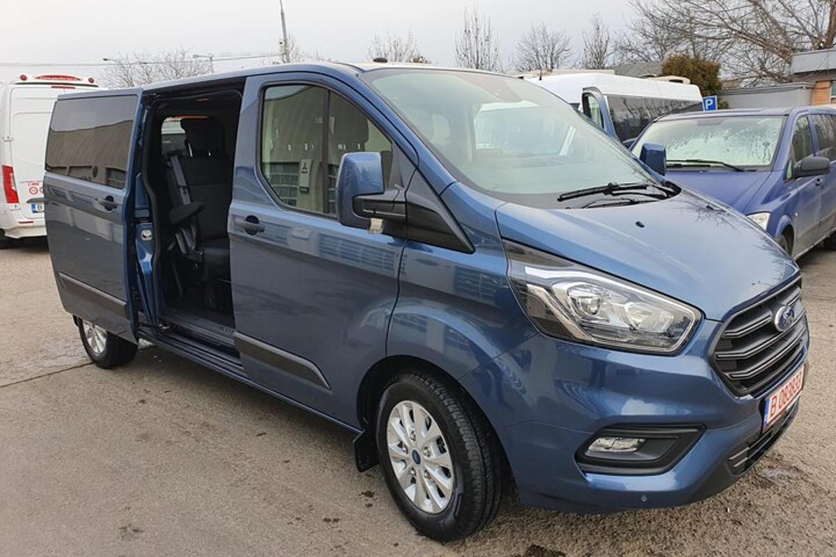 a blue van parked in a parking lot
