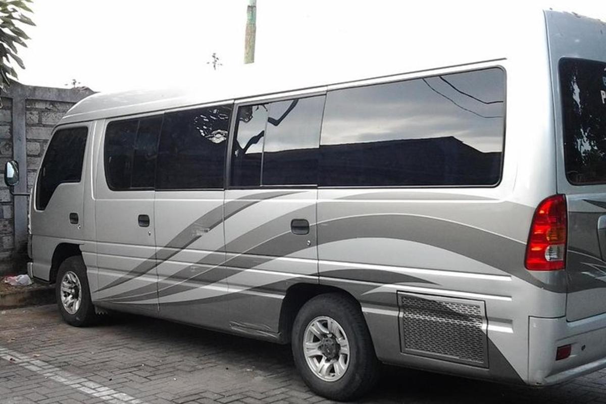 a silver van parked in a parking lot