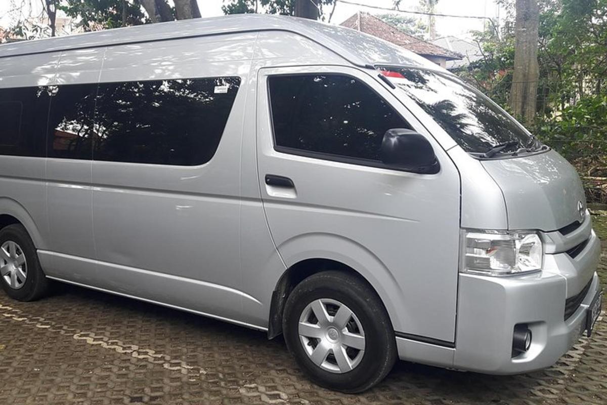a silver van is parked on a street