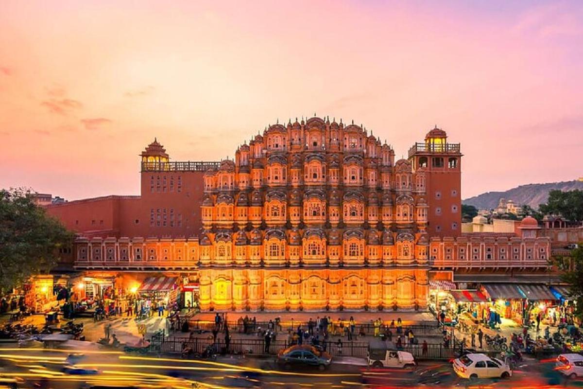 a large building is lit up at dusk
