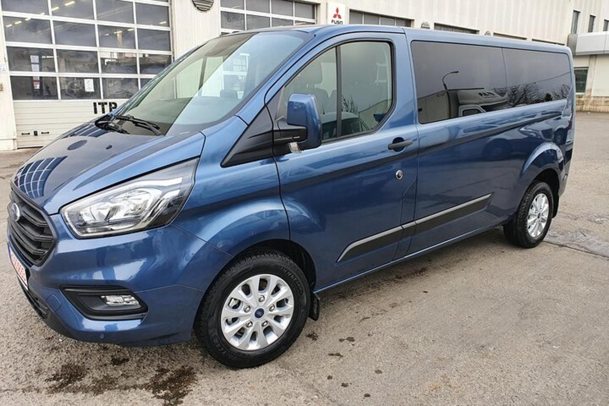 a blue van parked in a parking lot