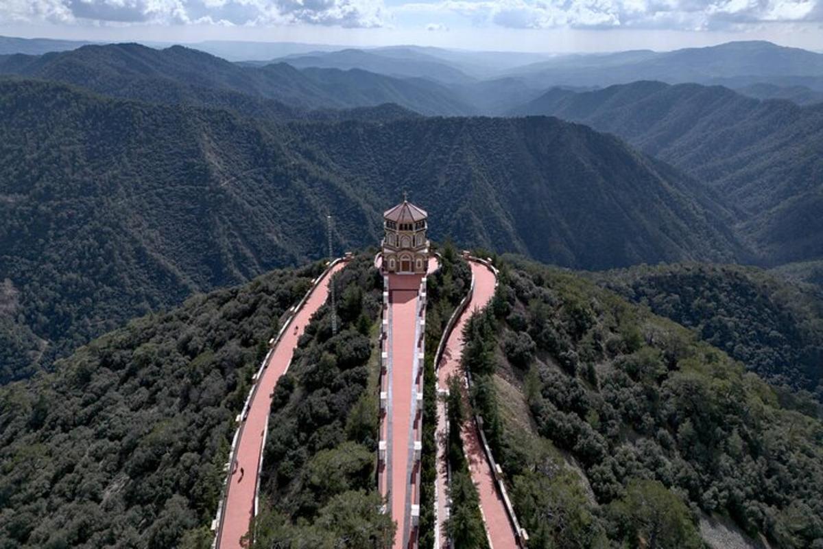an empty road in the middle of a mountain